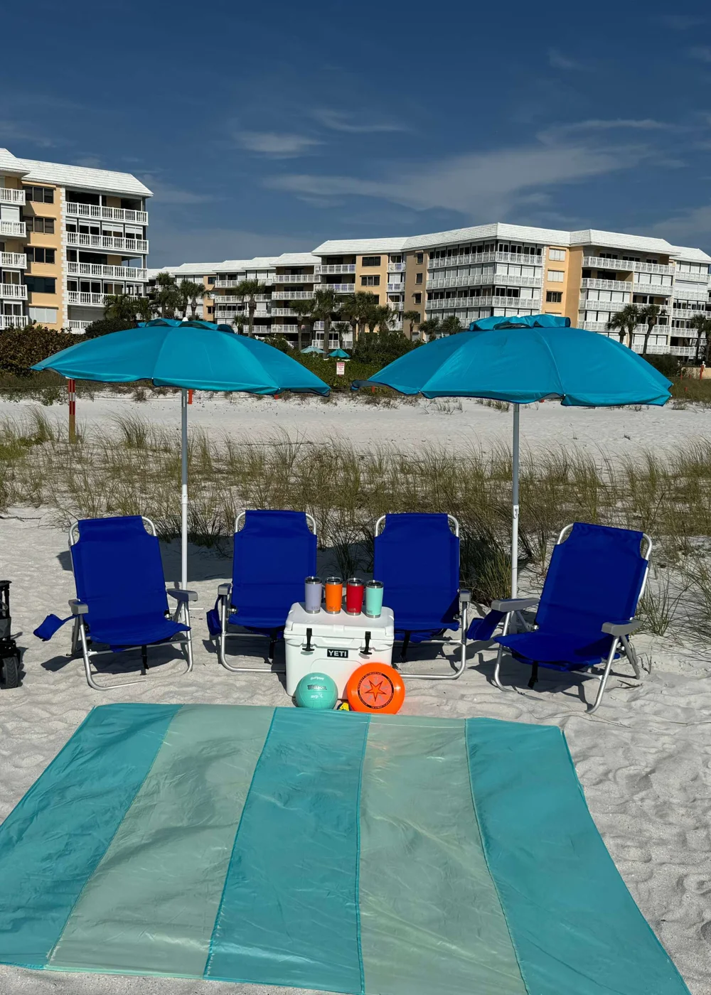 BeachDay’s actual rental gear: chairs, umbrellas, YETI cooler, tumblers and a large blanket